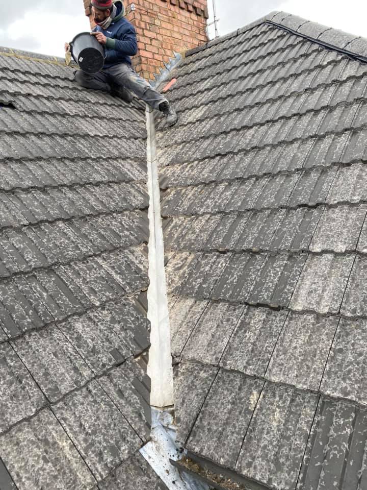 Professional roofers working on a property in London - KS Roof Master