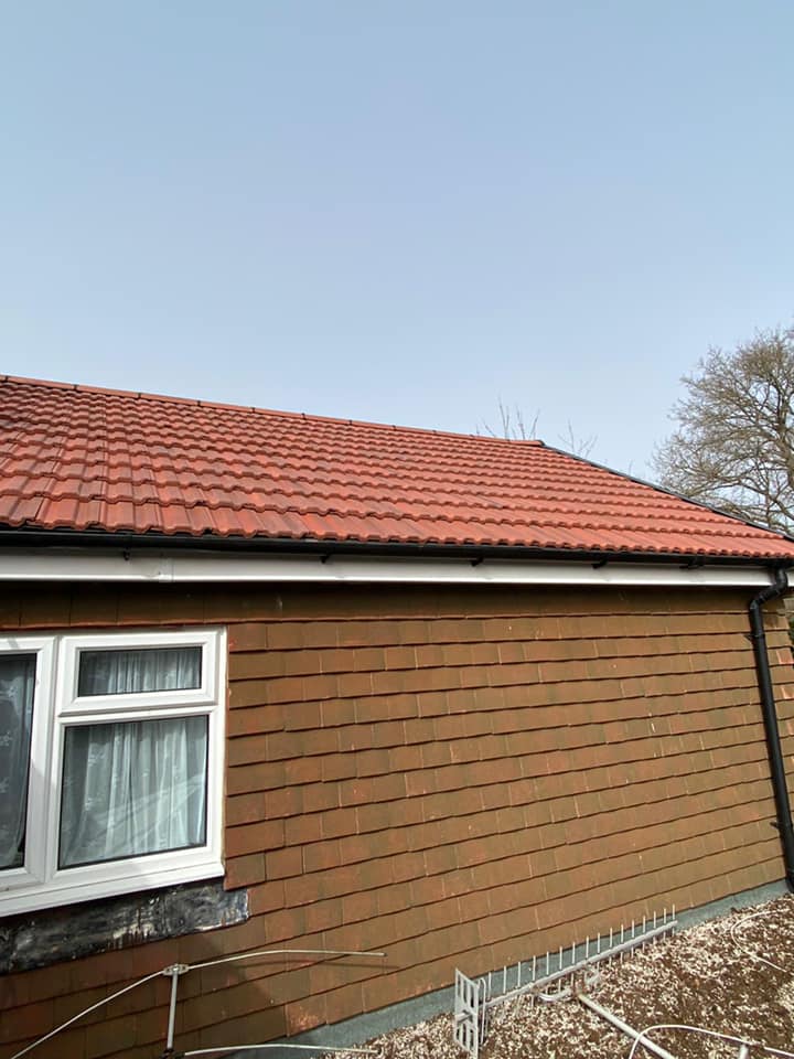 Professional roofers working on a property in London - KS Roof Master