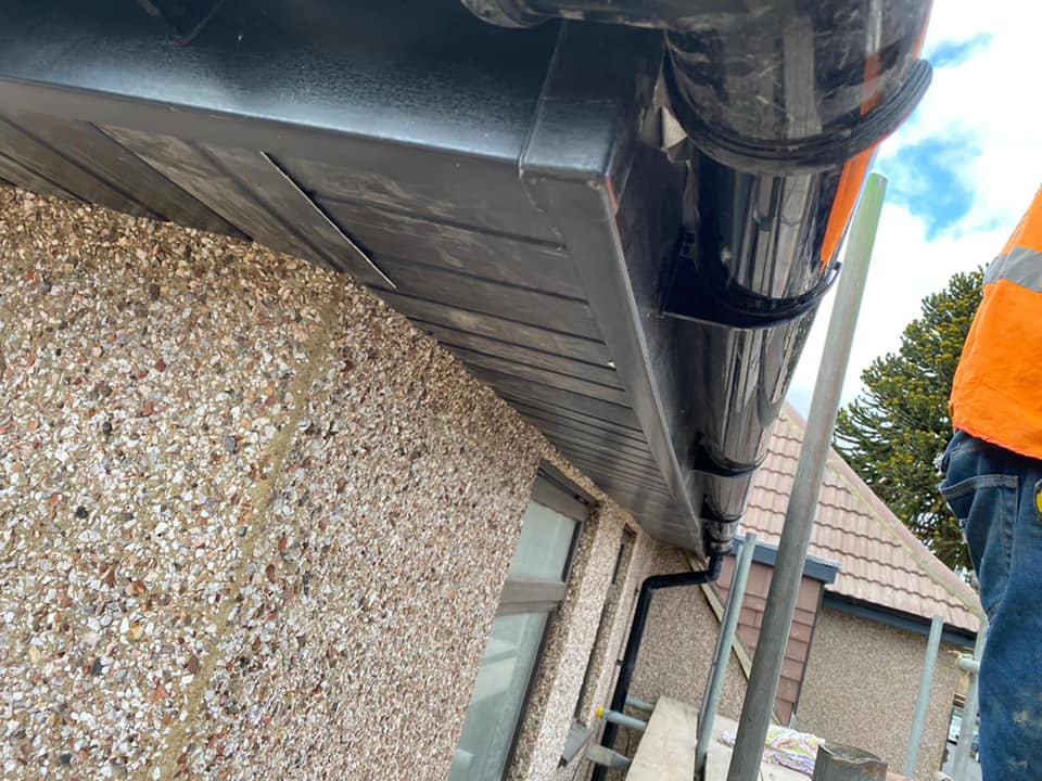 Professional roofers working on a property in London - KS Roof Master