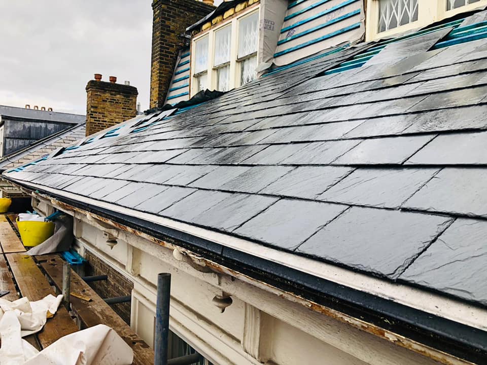 Professional roofers working on a property in London - KS Roof Master