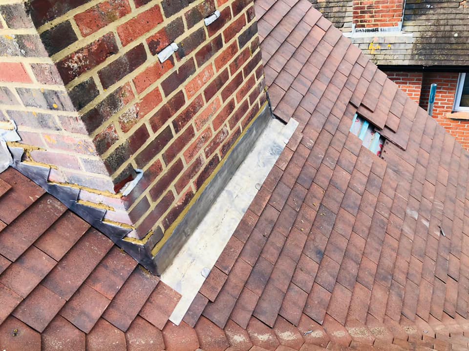 Professional roofers working on a property in London - KS Roof Master