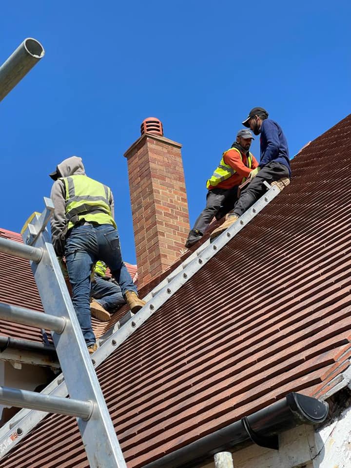 Professional roofers working on a property in London - KS Roof Master
