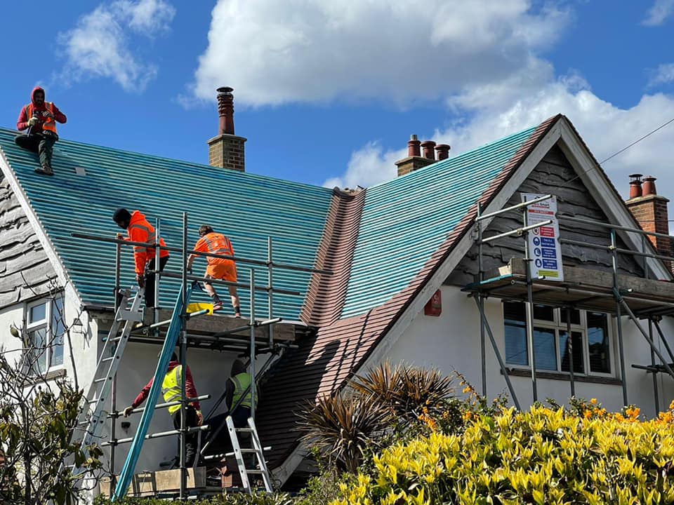 Professional roofers working on a property in London - KS Roof Master