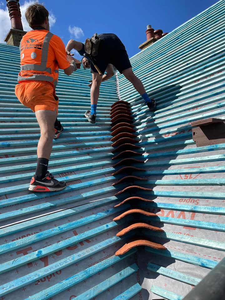 Professional roofers working on a property in London - KS Roof Master
