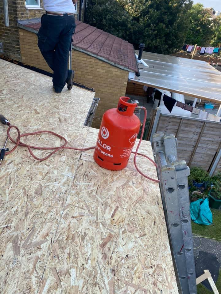 Professional roofers working on a property in London - KS Roof Master