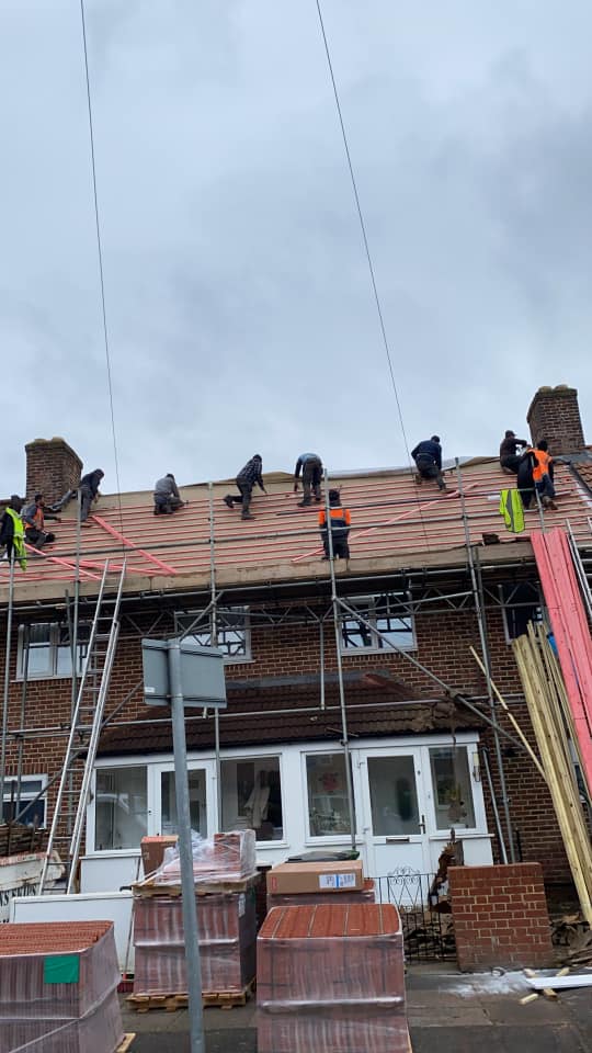 Professional roofers working on a property in London - KS Roof Master