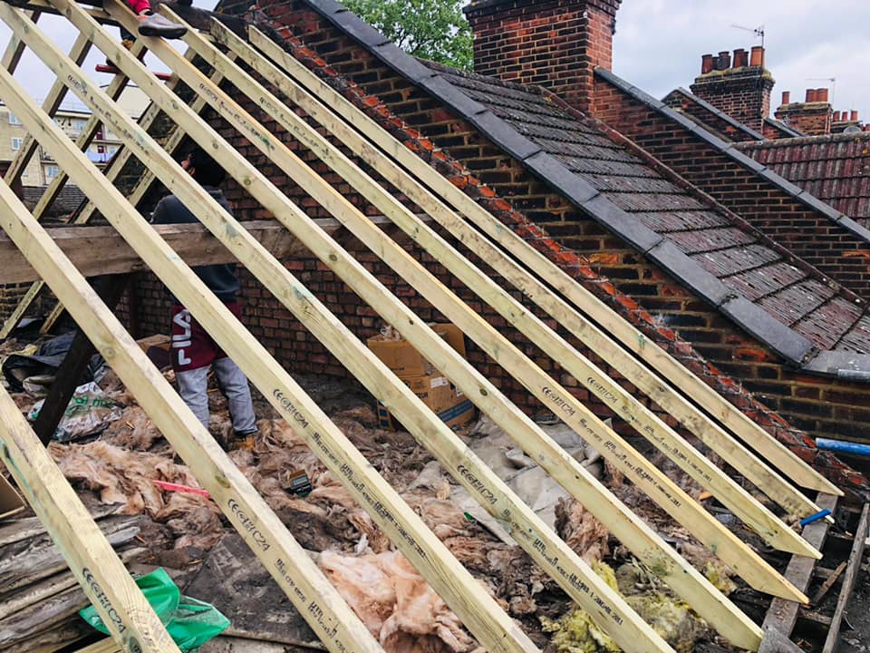 Professional roofers working on a property in London - KS Roof Master