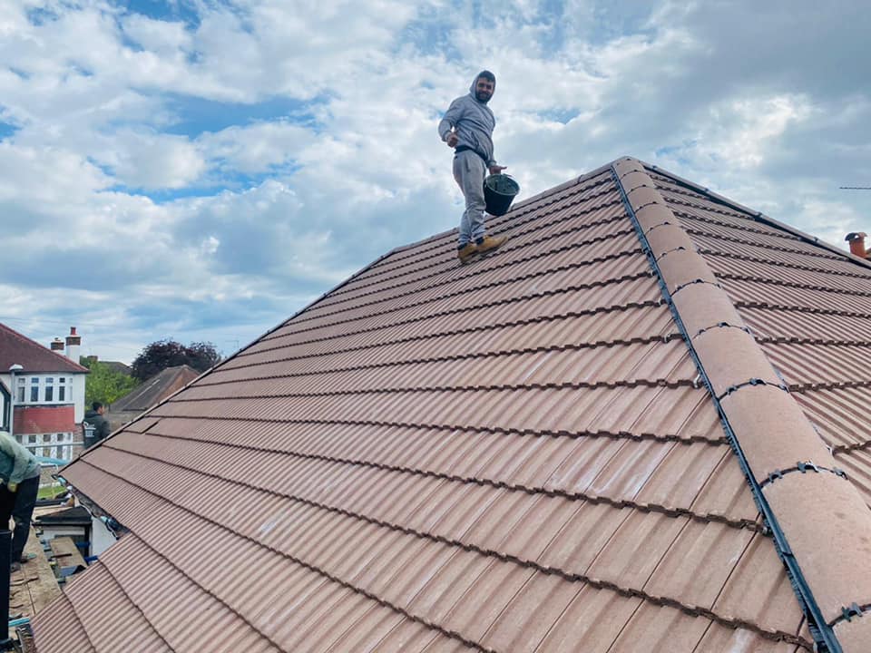 Professional roofers working on a property in London - KS Roof Master