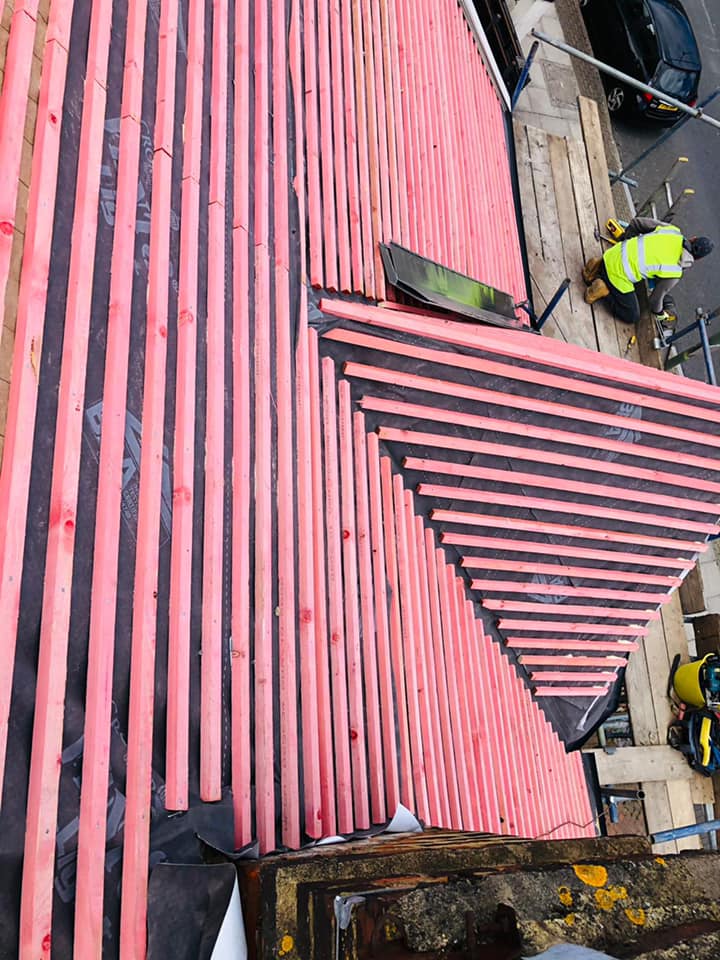 Professional roofers working on a property in London - KS Roof Master