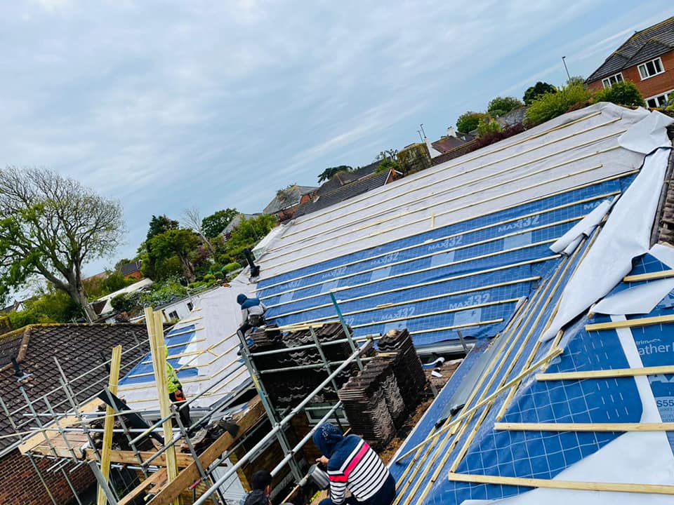 Professional roofers working on a property in London - KS Roof Master