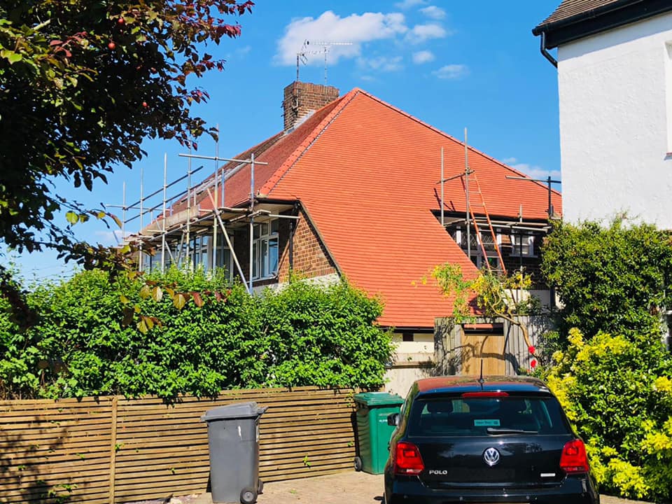 Professional roofers working on a property in London - KS Roof Master