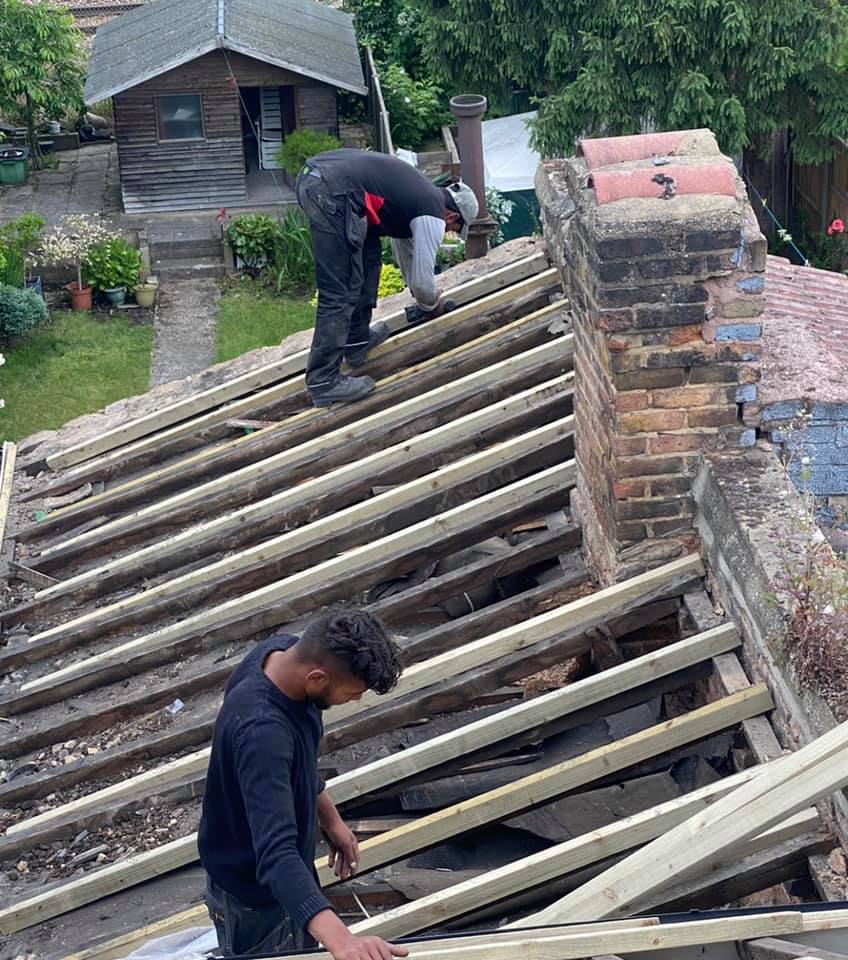 Professional roofers working on a property in London - KS Roof Master