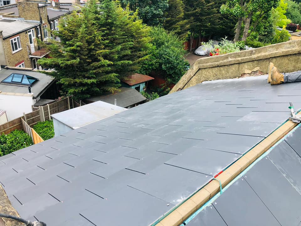 Professional roofers working on a property in London - KS Roof Master