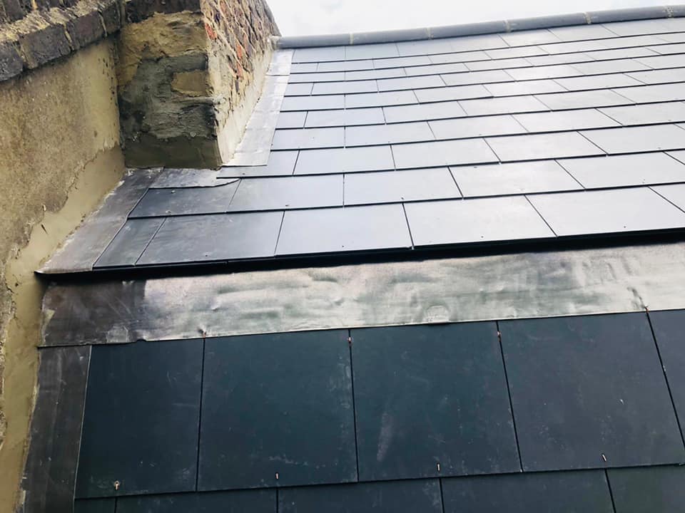 Professional roofers working on a property in London - KS Roof Master
