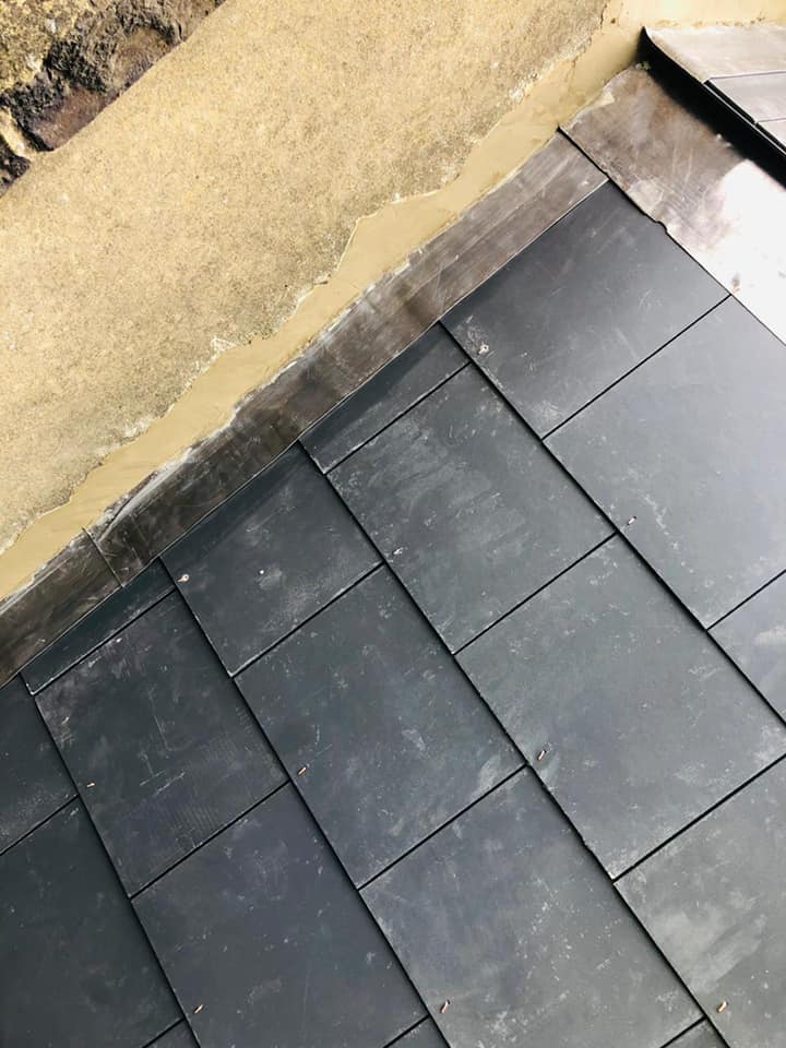 Professional roofers working on a property in London - KS Roof Master