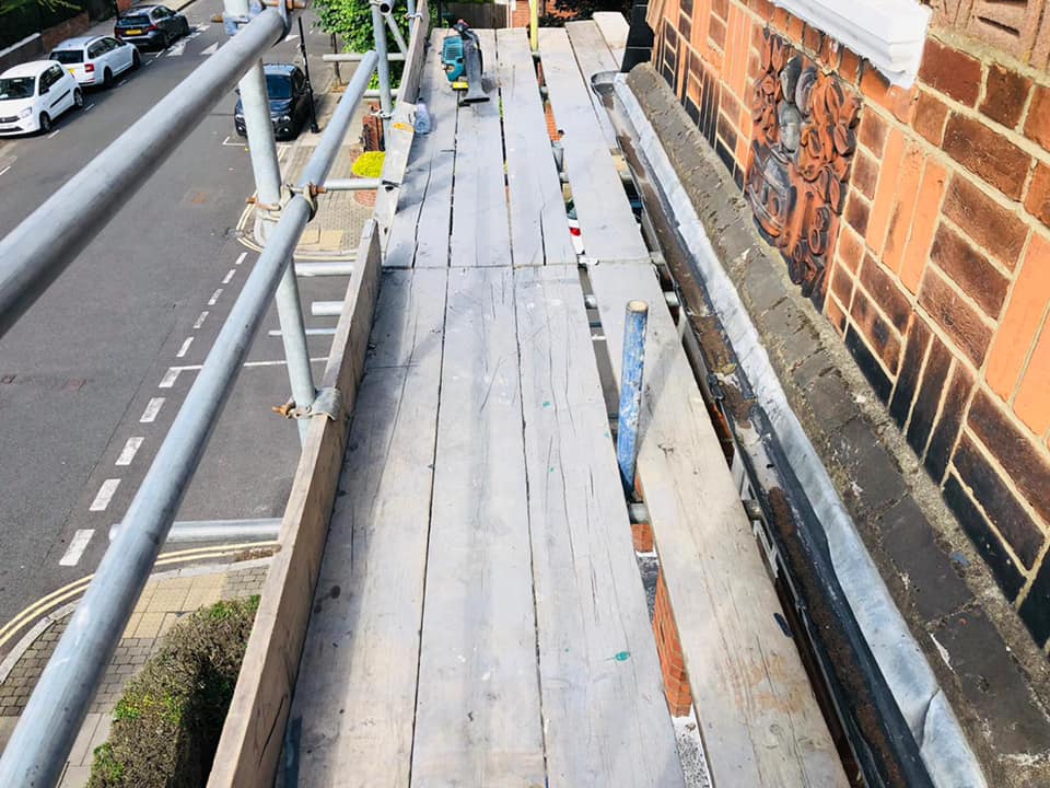 Professional roofers working on a property in London - KS Roof Master