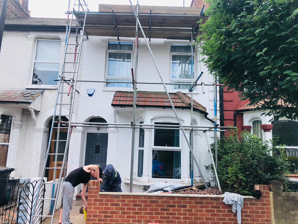 Professional roofers working on a property in London - KS Roof Master