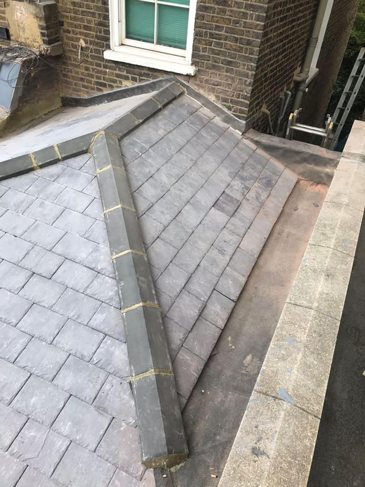 Professional roofers working on a property in London - KS Roof Master