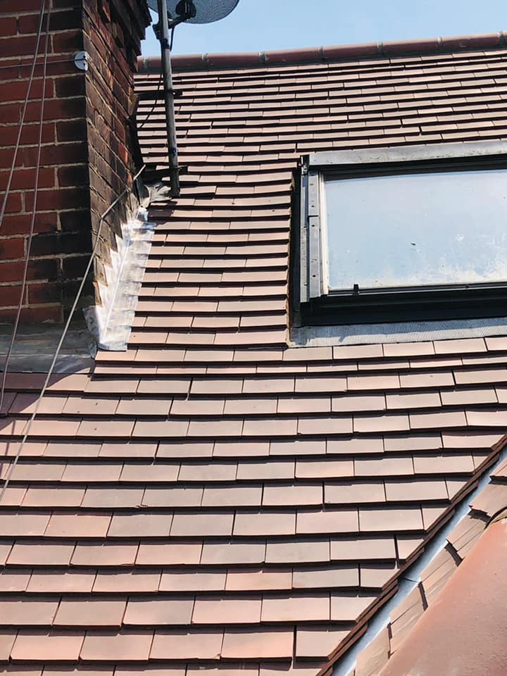 Professional roofers working on a property in London - KS Roof Master