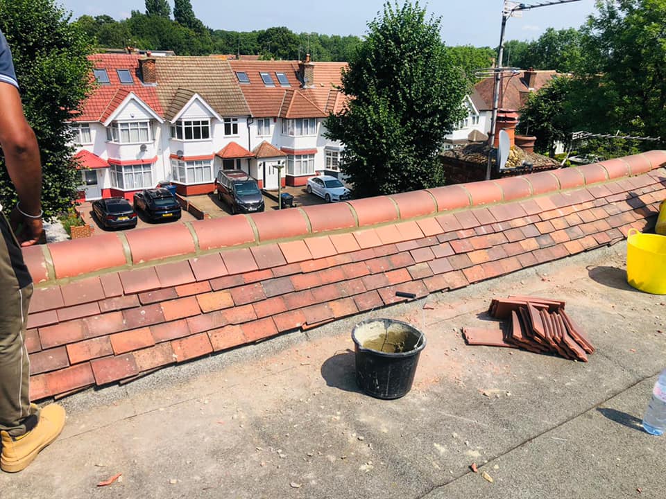 Professional roofers working on a property in London - KS Roof Master