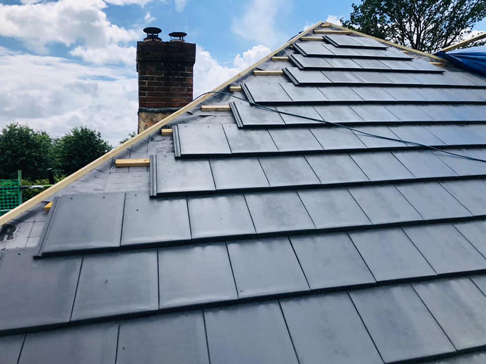 Professional roofers working on a property in London - KS Roof Master