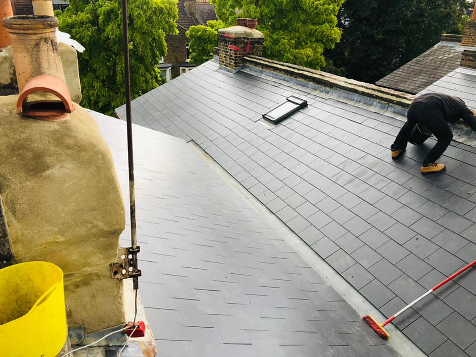Professional roofers working on a property in London - KS Roof Master