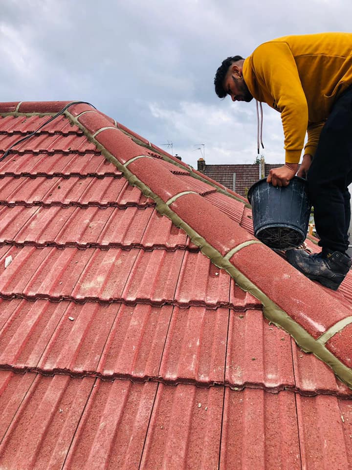 Professional roofers working on a property in London - KS Roof Master