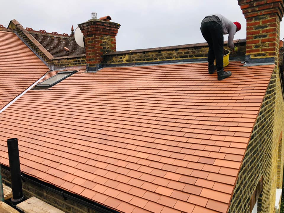 Professional roofers working on a property in London - KS Roof Master