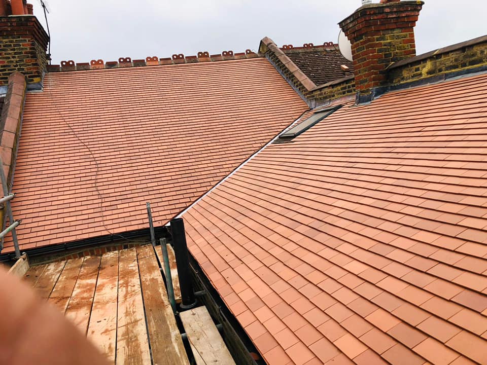 Professional roofers working on a property in London - KS Roof Master