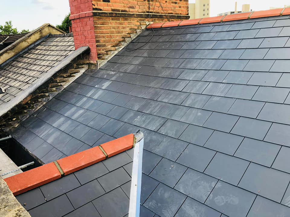 Professional roofers working on a property in London - KS Roof Master