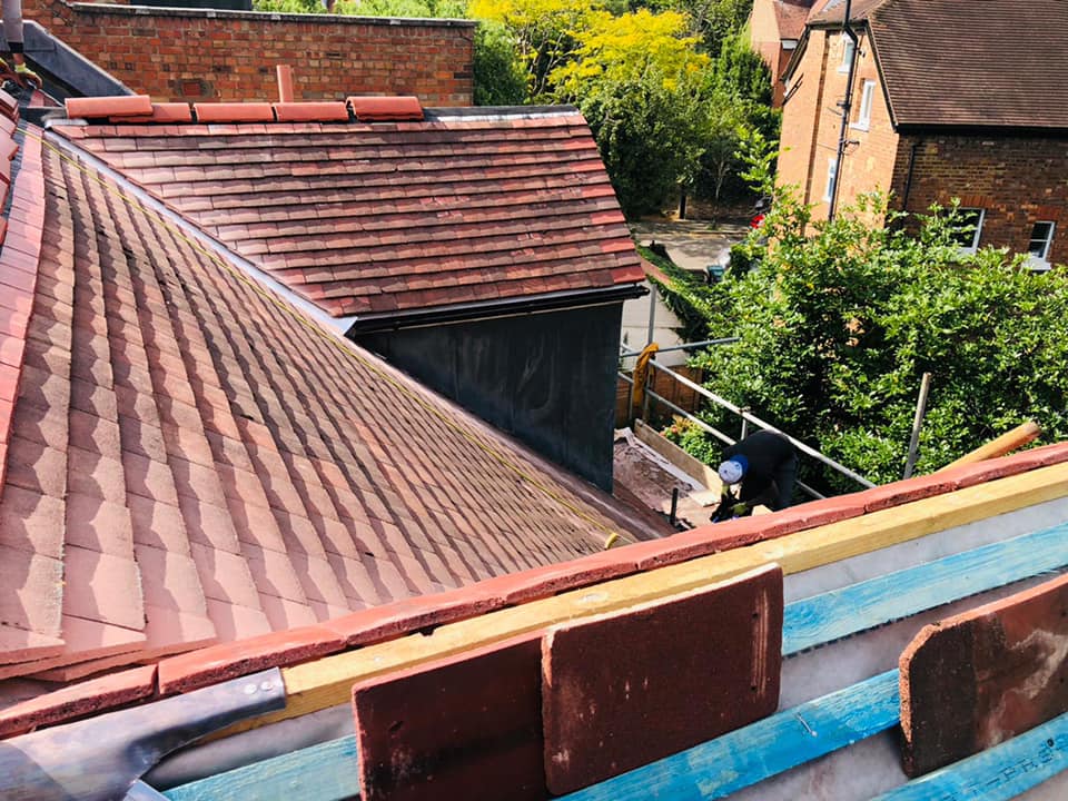 Professional roofers working on a property in London - KS Roof Master