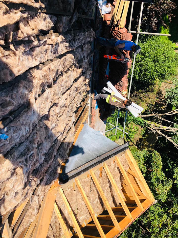 Professional roofers working on a property in London - KS Roof Master