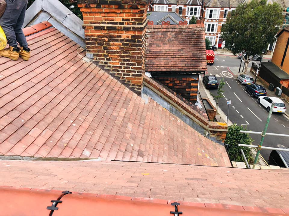 Professional roofers working on a property in London - KS Roof Master