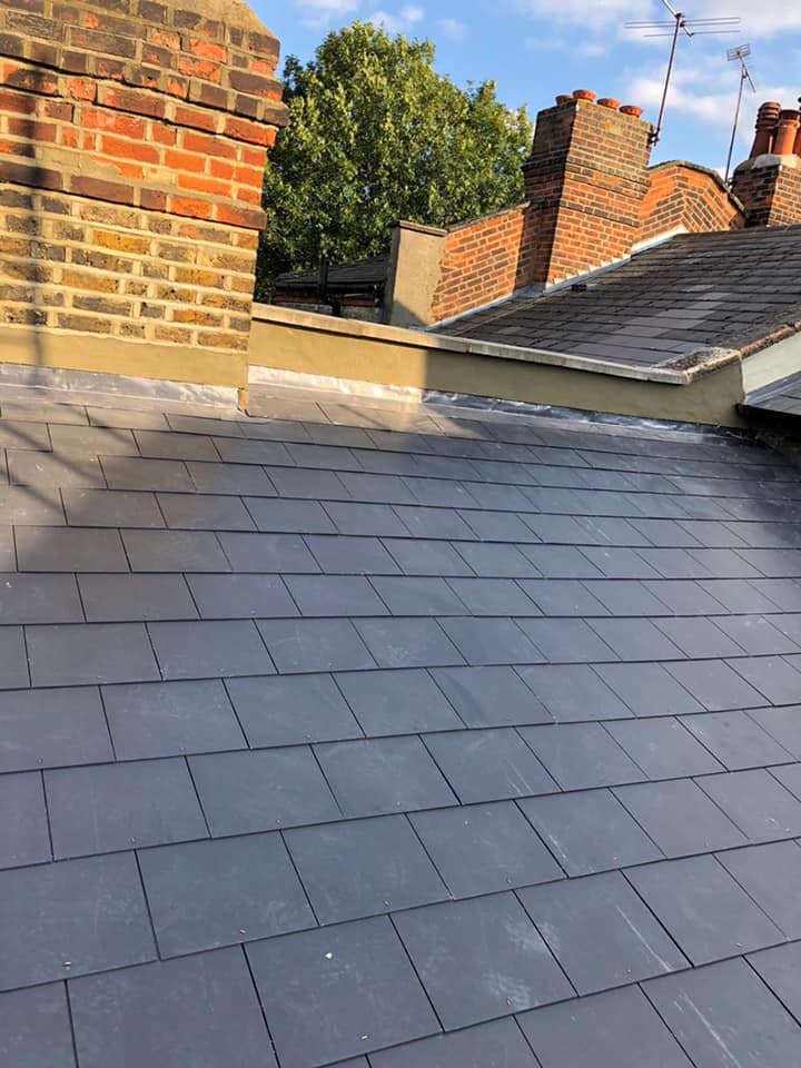 Professional roofers working on a property in London - KS Roof Master