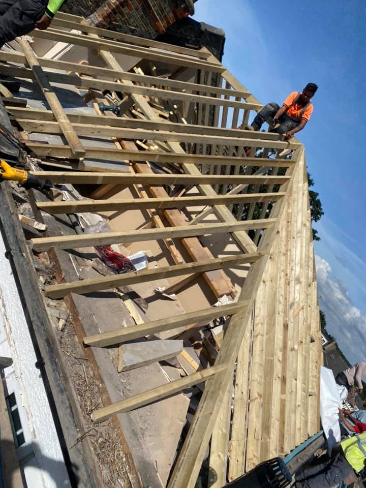 Professional roofers working on a property in London - KS Roof Master