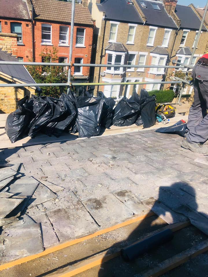 Professional roofers working on a property in London - KS Roof Master