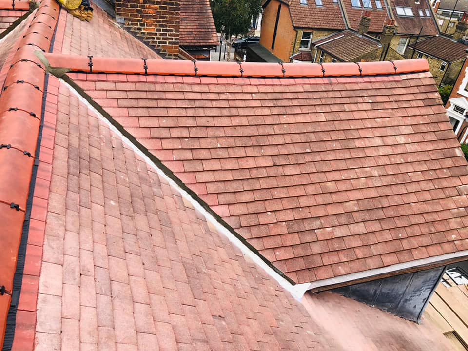 Professional roofers working on a property in London - KS Roof Master