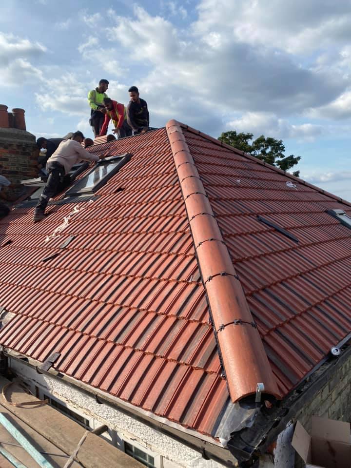 Professional roofers working on a property in London - KS Roof Master