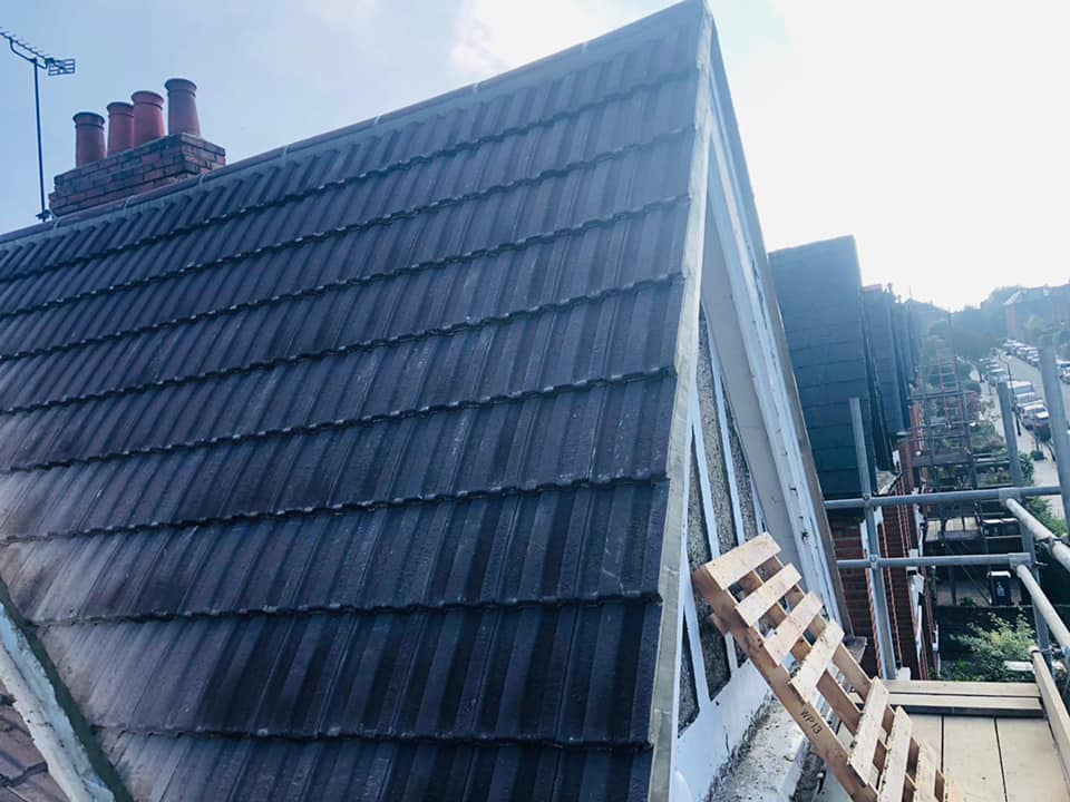 Professional roofers working on a property in London - KS Roof Master
