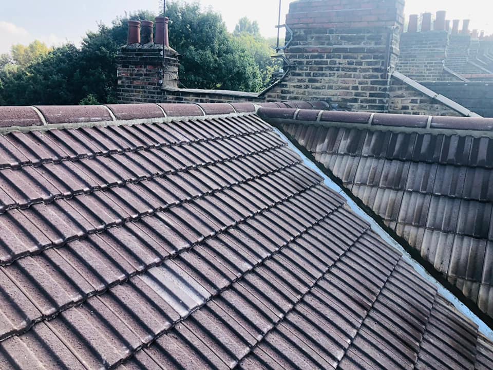 Professional roofers working on a property in London - KS Roof Master