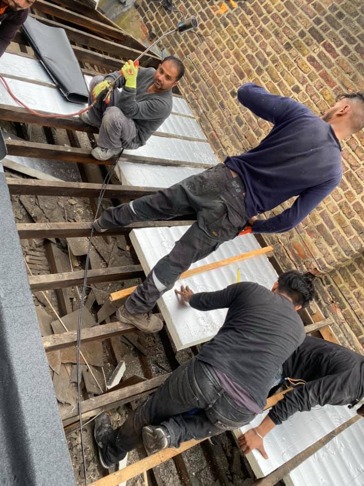 Professional roofers working on a property in London - KS Roof Master