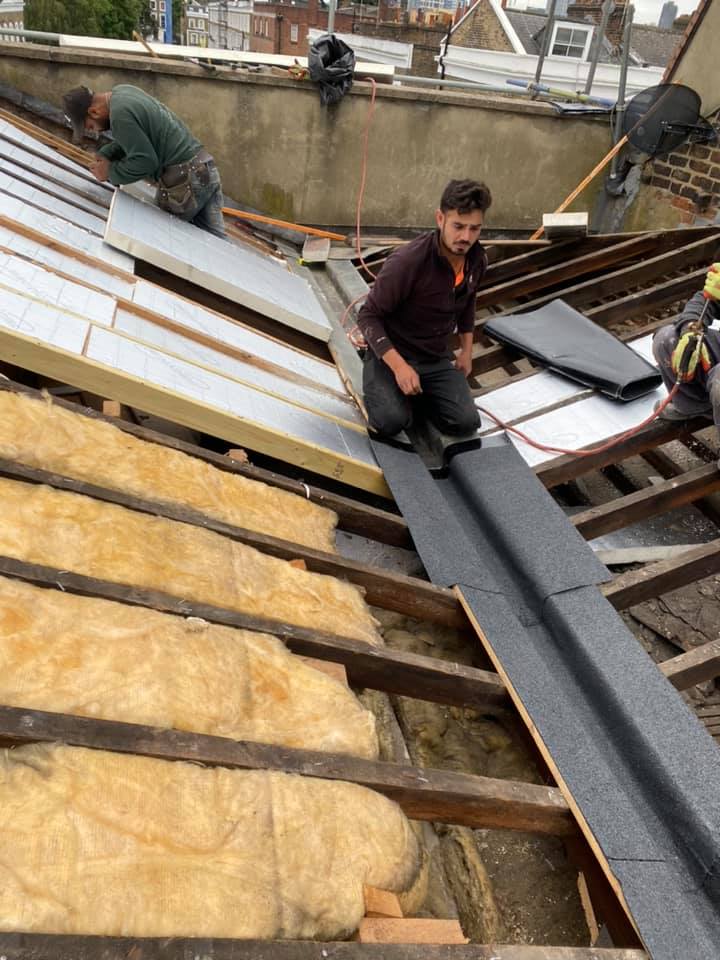 Professional roofers working on a property in London - KS Roof Master