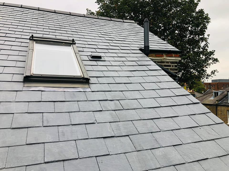 Professional roofers working on a property in London - KS Roof Master