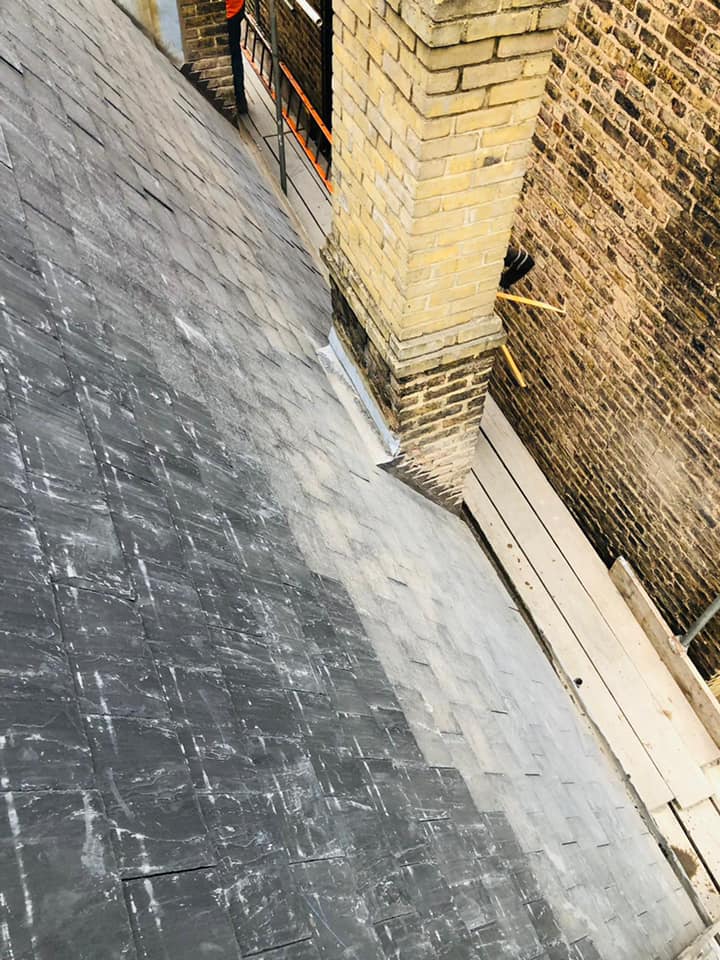 Professional roofers working on a property in London - KS Roof Master