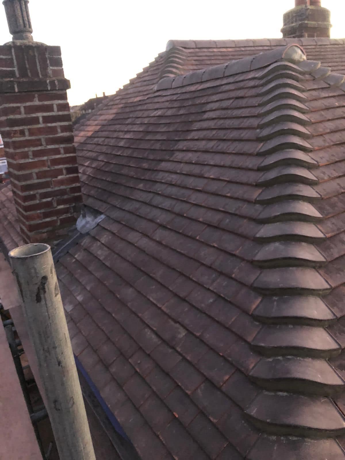 Professional roofers working on a property in London - KS Roof Master