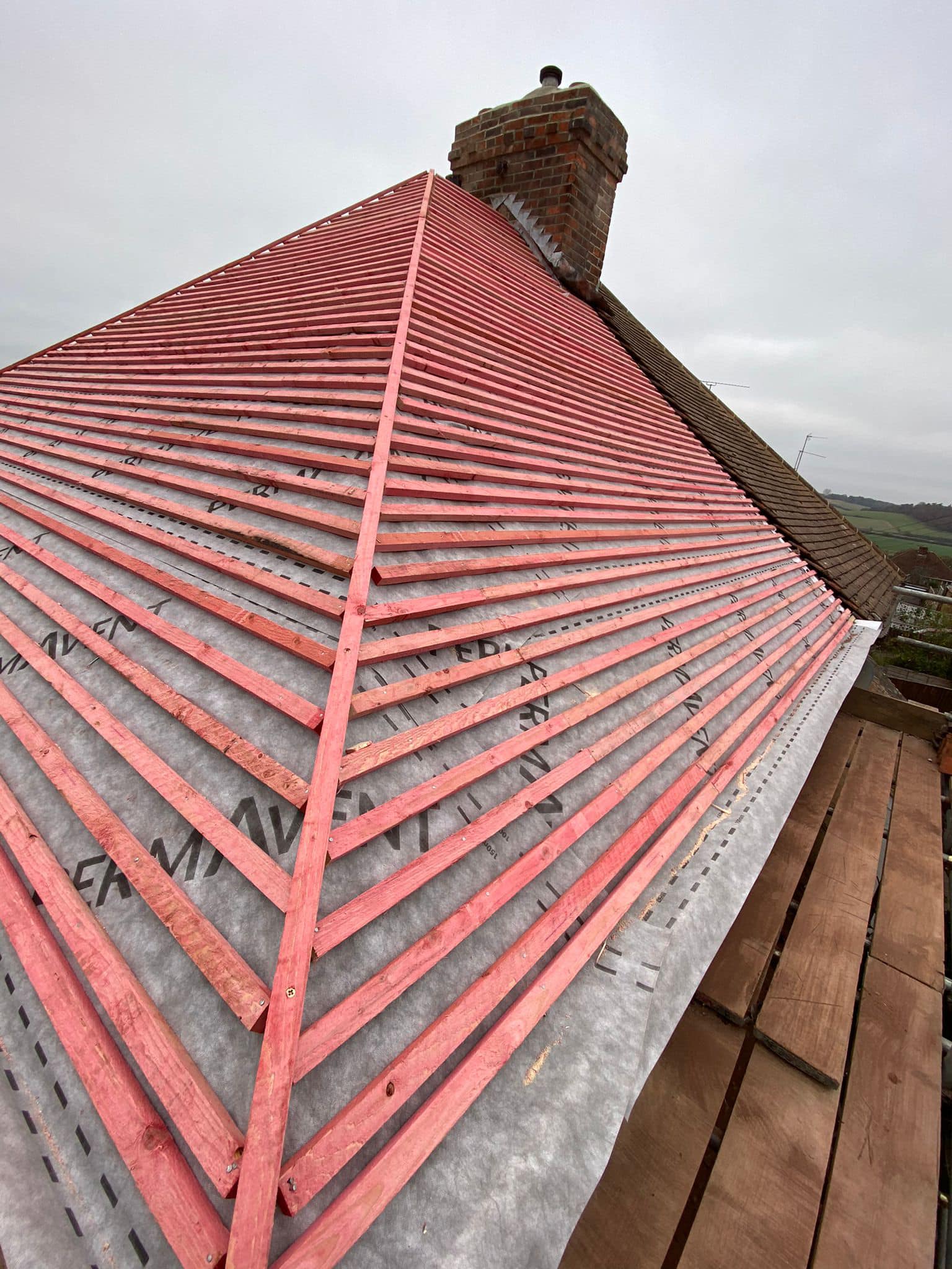 Professional roofers working on a property in London - KS Roof Master