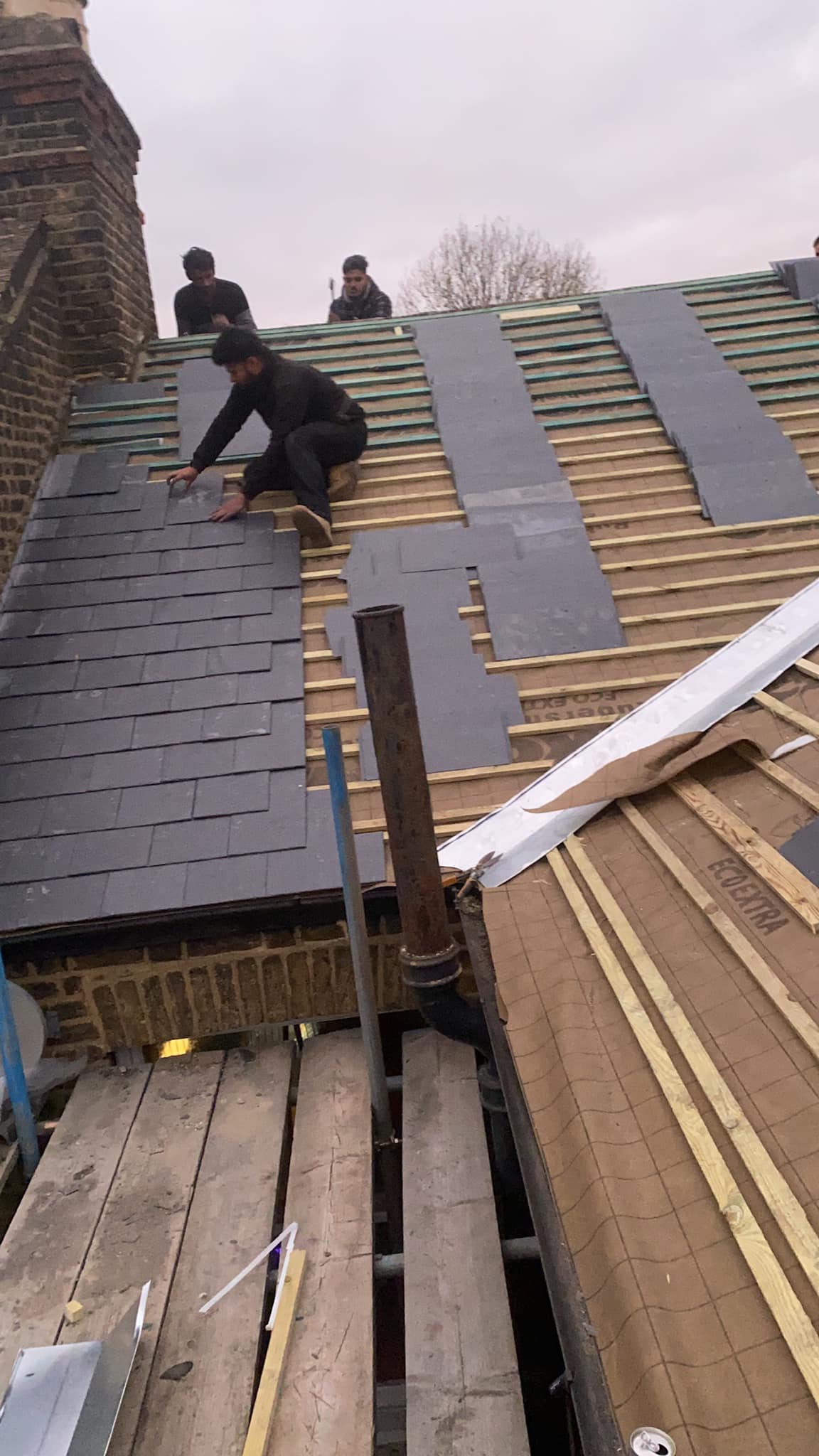 Professional roofers working on a property in London - KS Roof Master