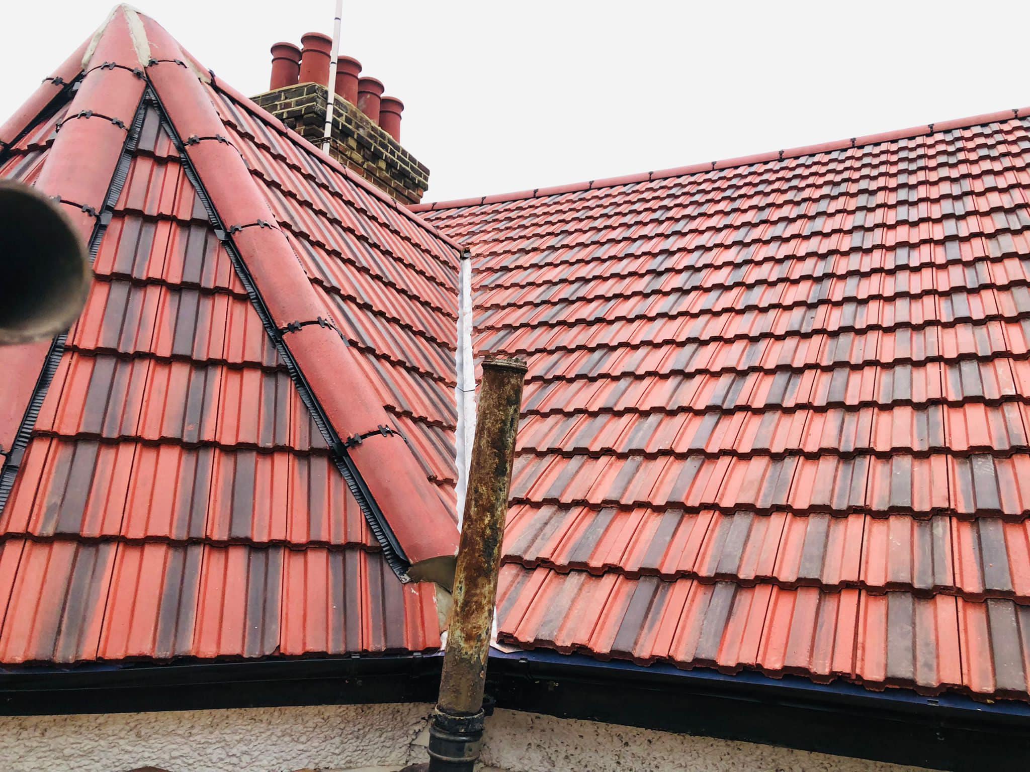 Professional roofers working on a property in London - KS Roof Master