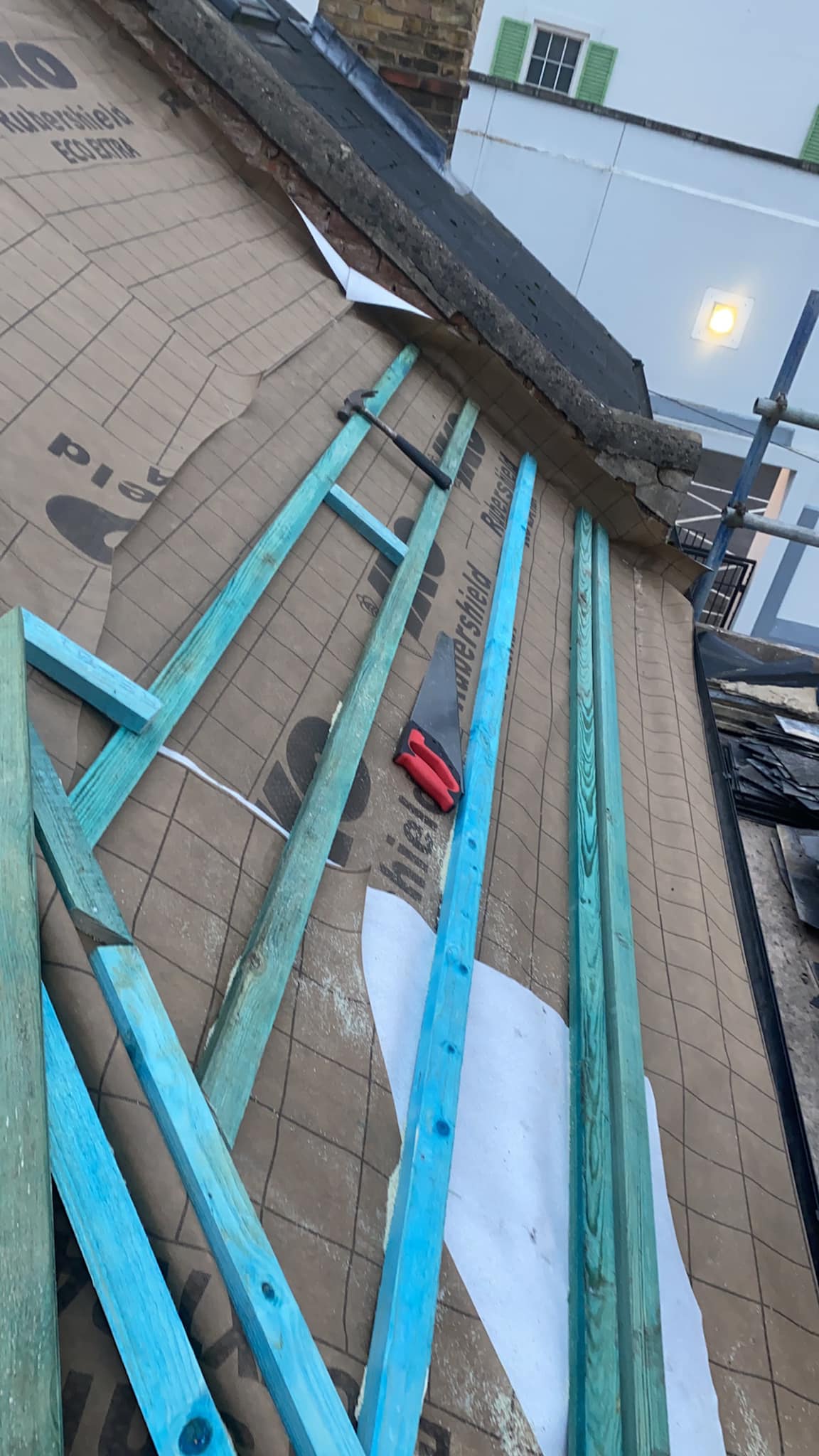 Professional roofers working on a property in London - KS Roof Master