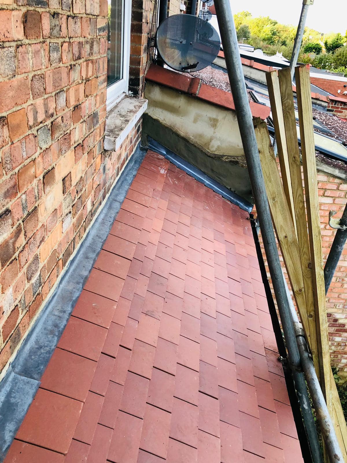 Professional roofers working on a property in London - KS Roof Master